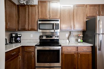 Kitchen with Stainless Steel Appliances located at Hall Creek Apts in Arlington, TN 38002